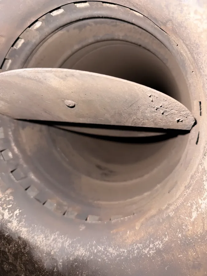 Close-up of a damper valve inside a chimney flue